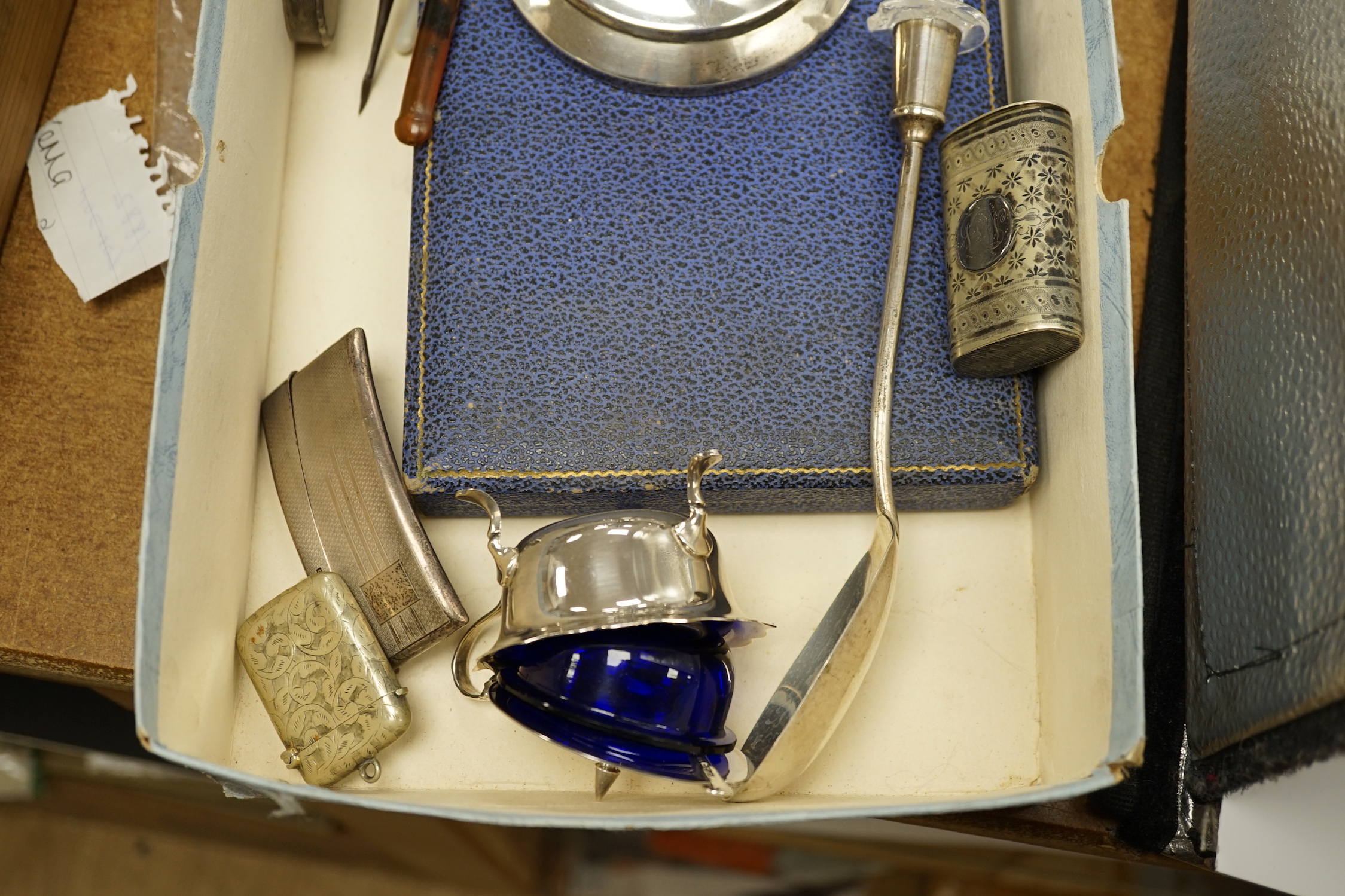 A quantity of assorted silver and sterling items including cigarette case, card case, vesta cases, mounted inkwell, glass handled salad server, plated vesta case, etc.